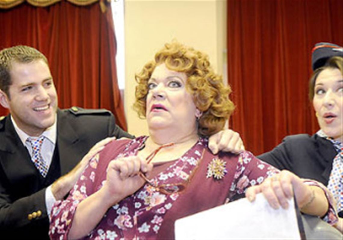 Jonathan Beyer as the Steward, left, and Katherine Drago as the Stewardess, right, sing "Don't Be Afraid of Flying" to Myrna Paris as the Older Woman in Pittsburgh Opera Center's "Flight."