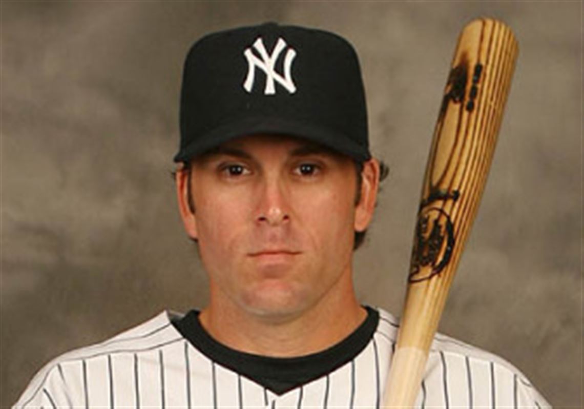 Doug Mientkiewicz, shown in a Yankees uniform, won a World Series with Boston in 2004.
