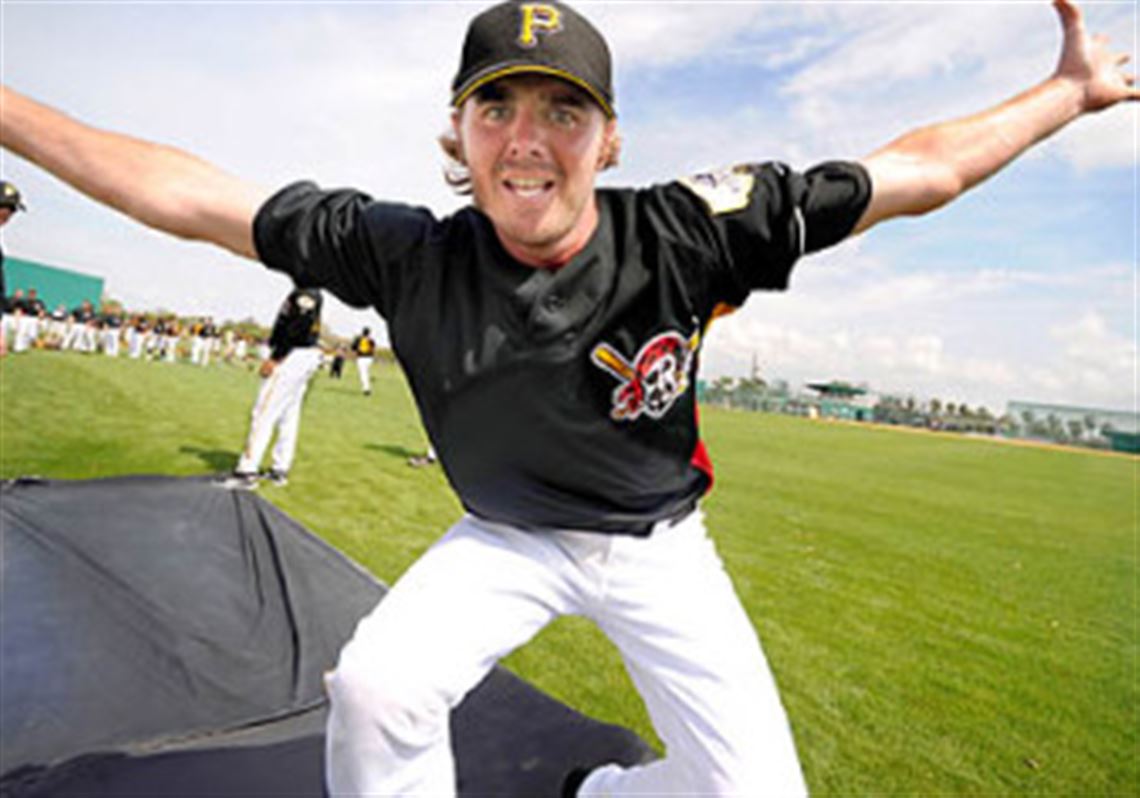 Pirates hopeful Josh Wilson -- a Mt. Lebanon graduate --  goes through a sliding drill early in camp.
