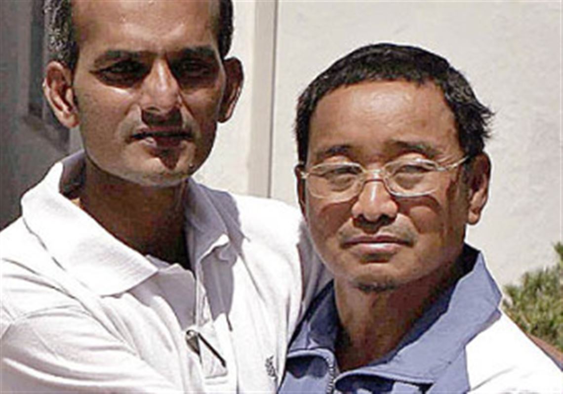 HERAT, Afghanistan -- Indian national Muhammad Naeem, left, and Nepalese national, Gurong Karna Bahudur, embrace after being released by kidnappers. Intelligence agents freed the men who were kidnapped a month ago by unknown militants.