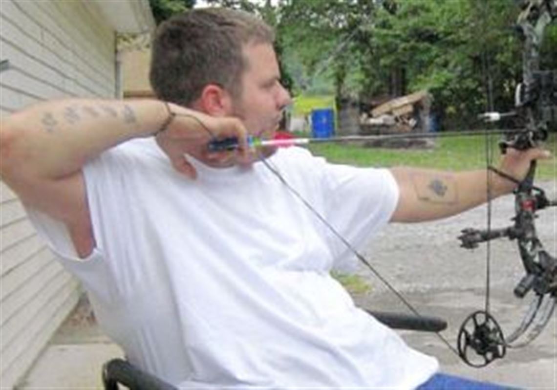Practice is the key to successful bow hunting. Jason "KJ" Polish takes aim outside KJ's Kustom Archery in Carmichaels, Greene County.