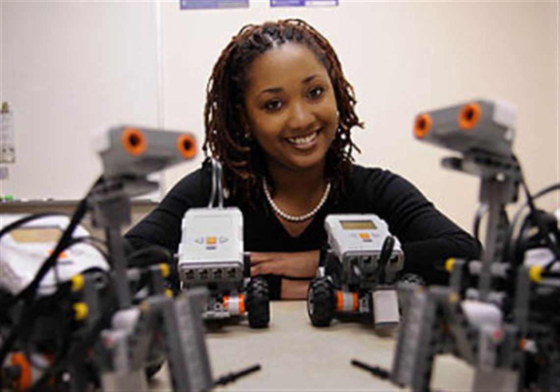 Tonya Groover, a University of Pittsburgh graduate student, helps pique STEM interest by having high school students build robots.