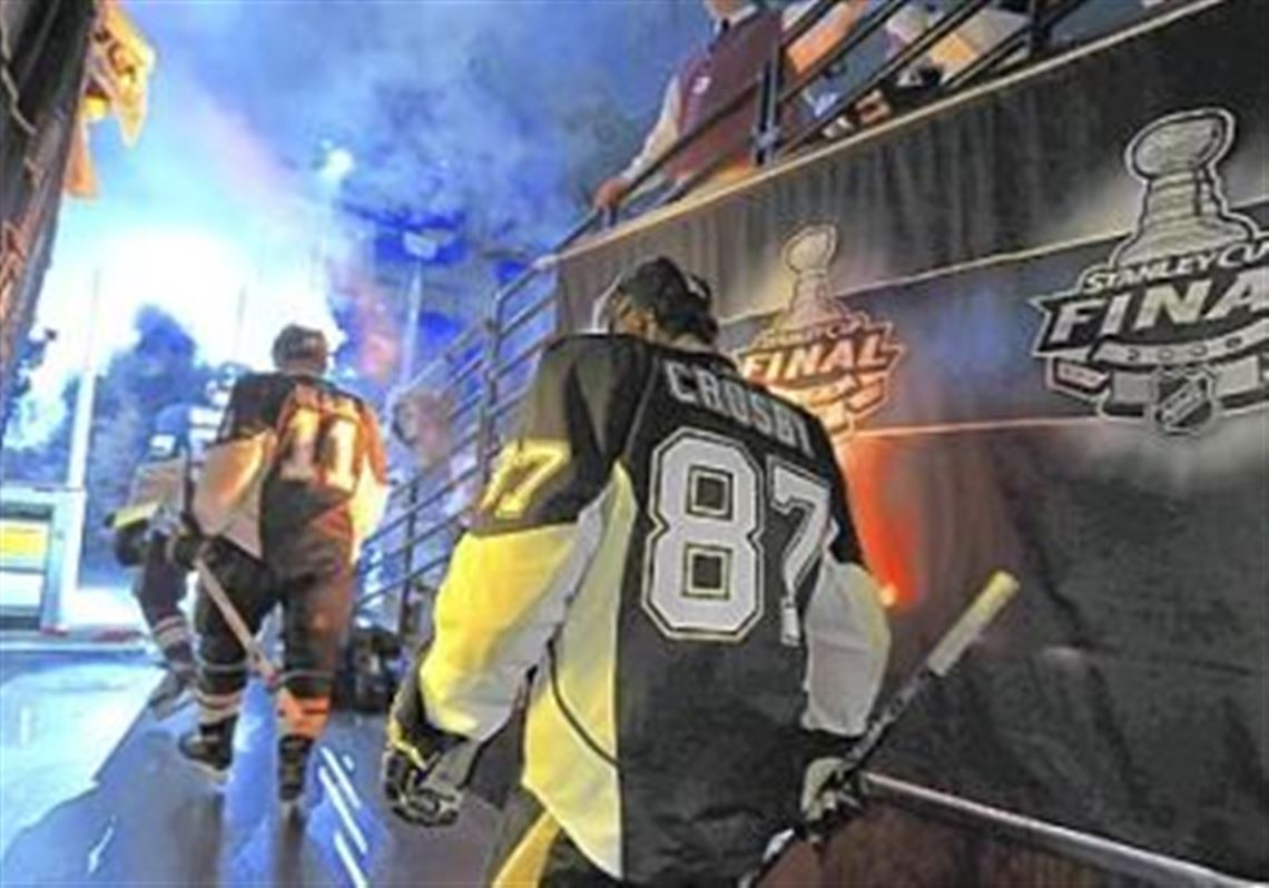 Penguins captain Sidney Crosby and teammates make their way to the ice.