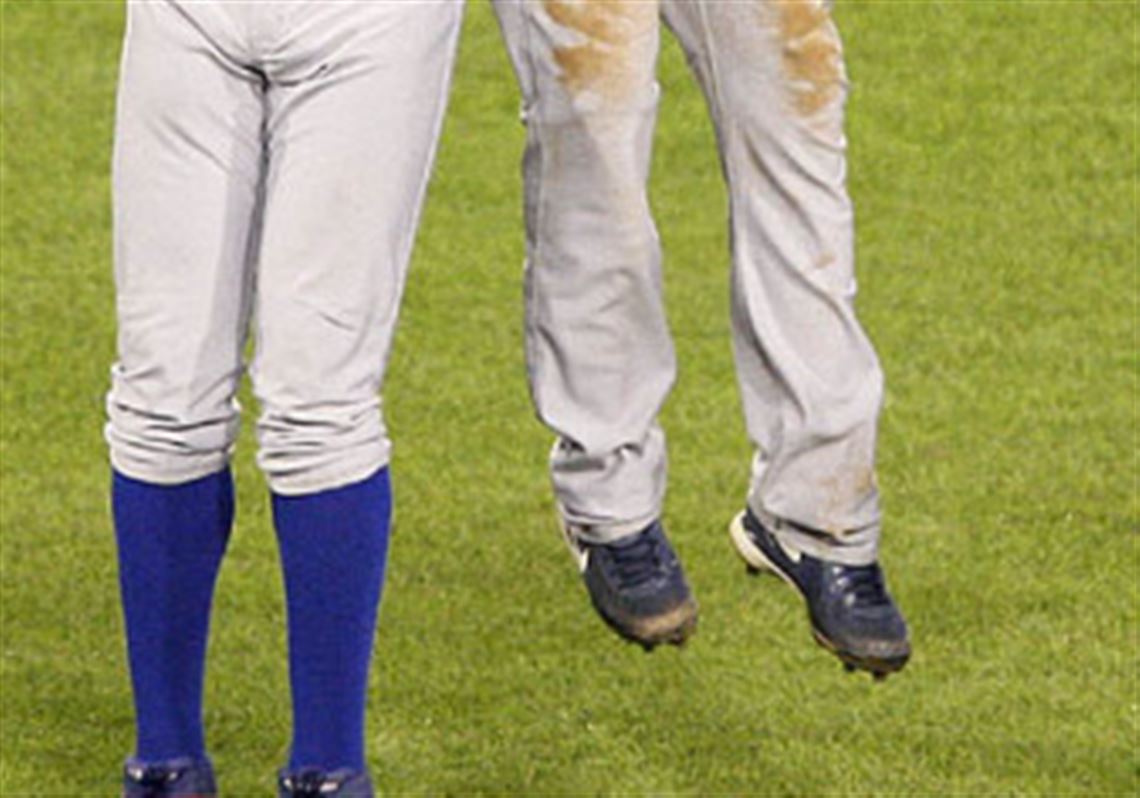 Cubs left fielder Alfonso Soriano, left, and teammate Ryan Freel celebrate after the final out of the Cubs' 3-1 win last night.