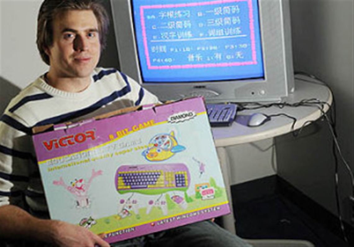 Carnegie Mellon University graduate student Derek Lomas holds a cheap, low-powered computer he purchased in India. He's co-founder of a nonprofit that is creating educational software featuring games that can be used on this type of computer == games that will be given away in developing nations.