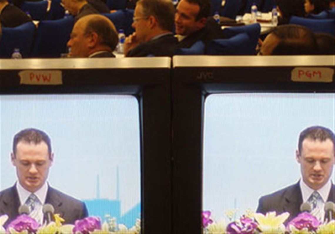 Pittsburgh Mayor Luke Ravenstahl is seen on closed circuit monitors in a conference hall in Shanghai.
