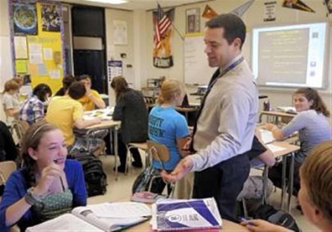 Mt. Lebanon High School math teacher Pete Bouvy teaches a "flipped" class where students view a video of his lecture on their own time and get individual help on their homework from Bouvy during class.