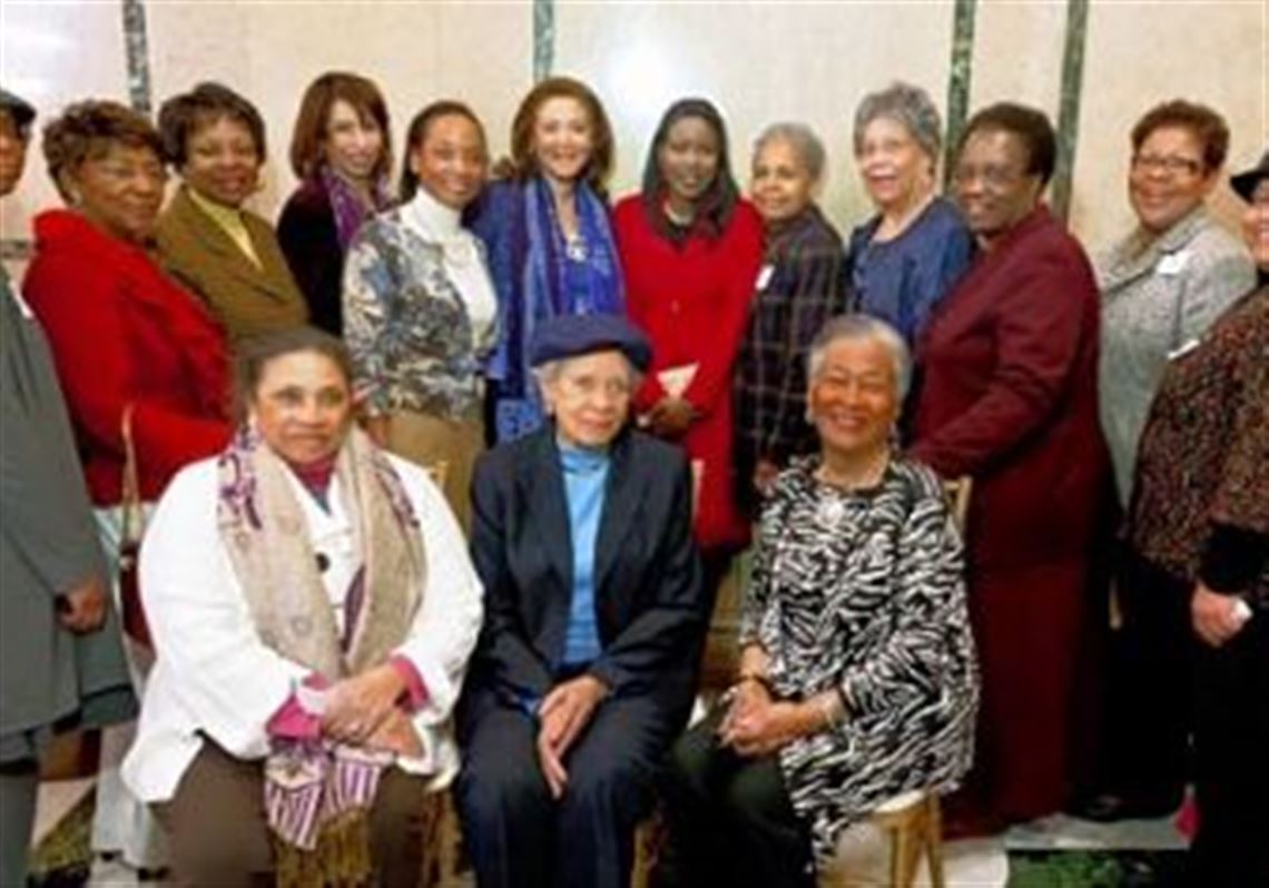 Members of the Aurora Reading Club co-sponsored a Jan. 30 reception at Carnegie Music Hall for two authors. Book club members, seated from left, are Martha Conley, Cecilia Williams and Florence Johnson. Standing, from left, are Inez Miles, Beatrice Vasser, Margaret Burley, Charlene Foggie Barnett, Pam Golden, authors Michele Norris and Isabel Wilkerson, Sarah McDaniel, Emma Odim, Ada Ezekoye, Mildred Morrison and Marylee Giles.