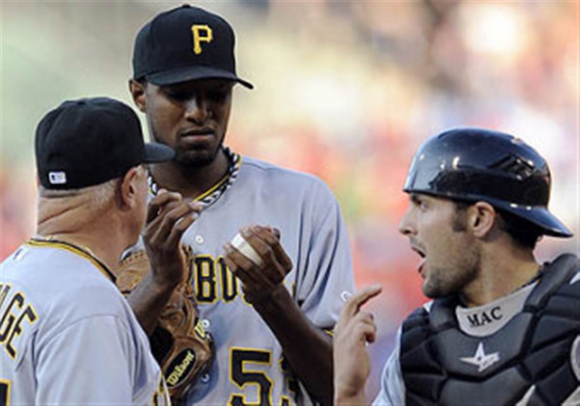 Pirates pitcher James McDonald talks to Ray Searage and catcher Michael McKenry after the Phillies' Carlos Ruiz hit a home run in the first inning.