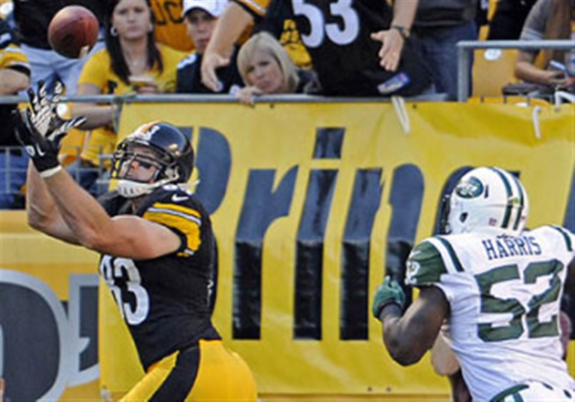 Heath Miller pulls in a pass for a touchdown as he's defended by the Jets' David Harris in the second quarter at Heinz Field Sunday.