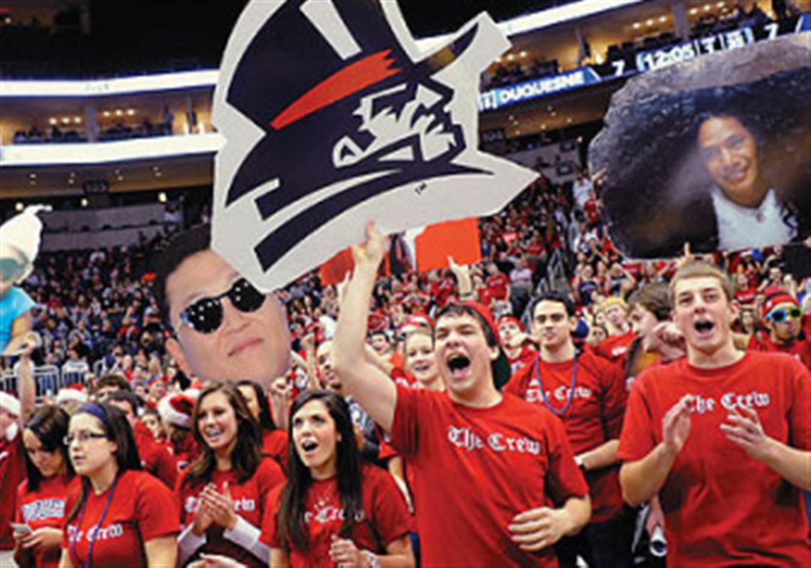 Duquesne students cheer on their team as it takes on Pitt during the City Game at Consol Energy Center.