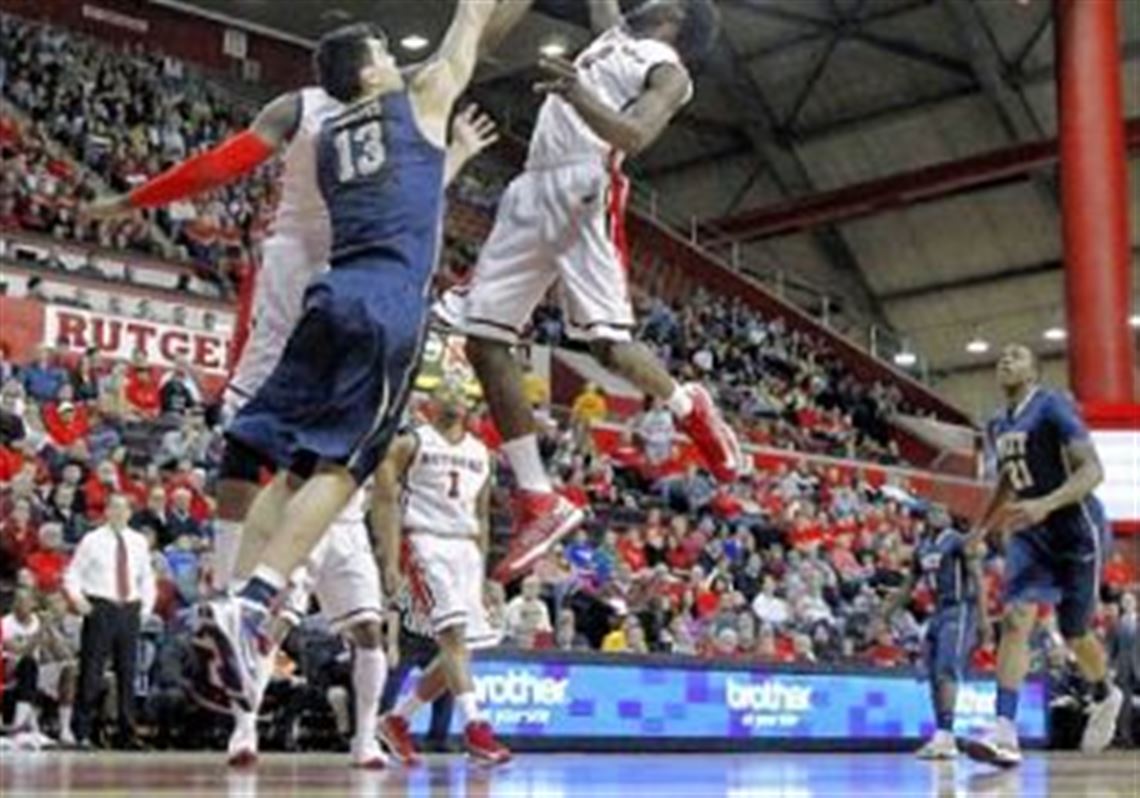 Rutgers' Dane Miller and Pitt's Steven Adams battle under the basket in the first half Saturday in Piscataway, N.J. Rutgers won, 67-62.