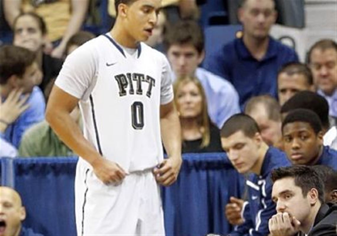 Pitt coach Jamie Dixon squats along the bench as time runs down in the overtime period Saturday against Marquette. The Panthers lost, 74-67, to drop to 1-3 in the Big East.