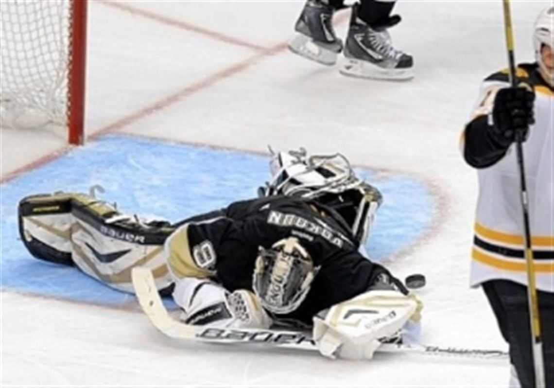 The Bruins' Milan Lucic celebrates a goal by Nathan Horton on Penguins goaltender Tomas Vokoun in the third period of Game 1.