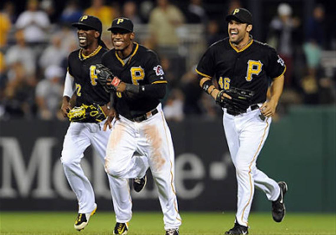 Pirates' Andrew McCutchen, Starling Marte and Garrett Jones come off the field after defeating the Brewers at PNC Park Friday night.