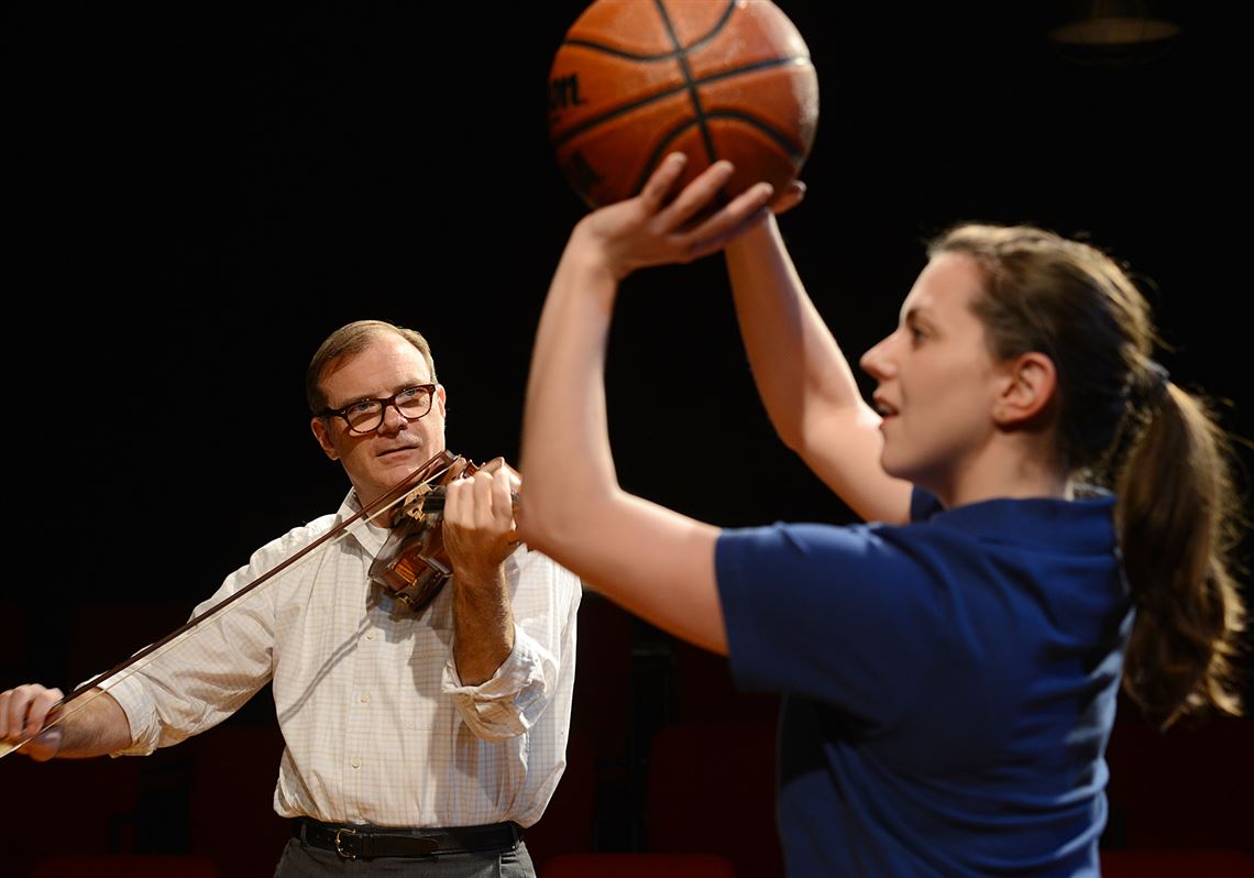 Drew McVety as John Starr, left, and Tressa Glover as Coach Laura Starr in City Theatre's production of Charles Ives' "Take Me Home."  
