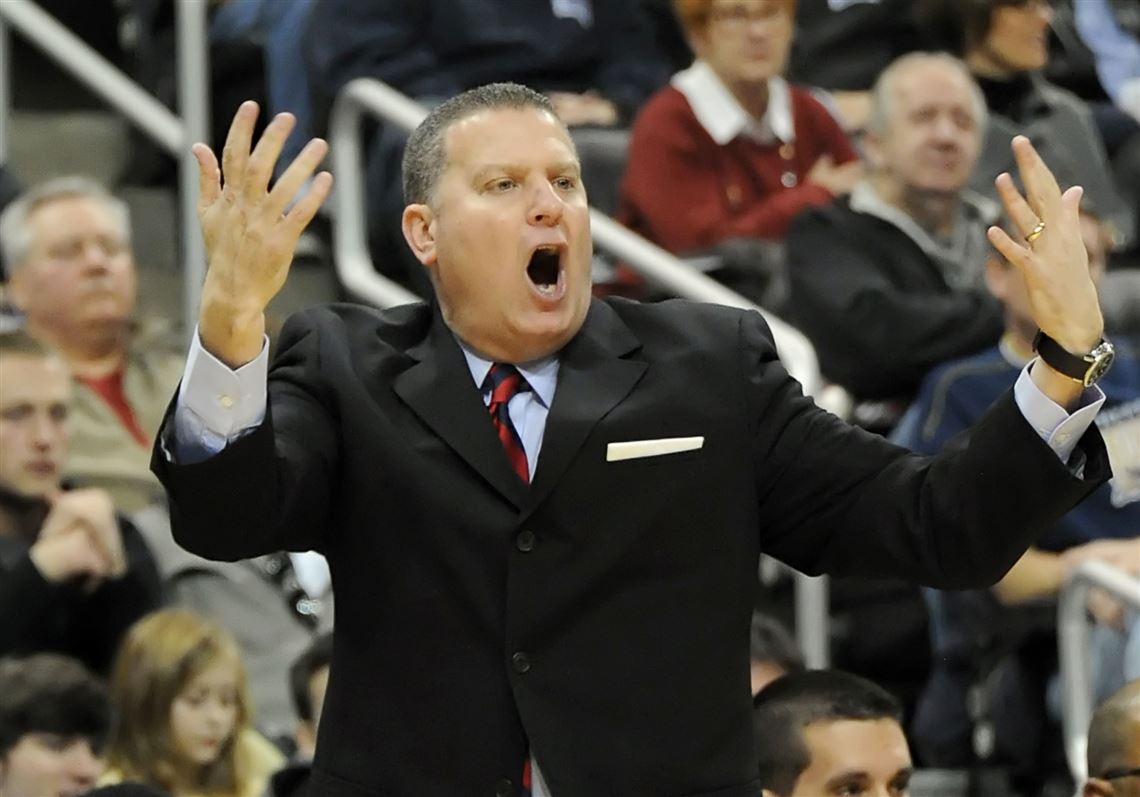 Duquesne head coach Jim Ferry yells to his team as they take on Pitt in the first half of the City Game at Consol Energy Center. 
