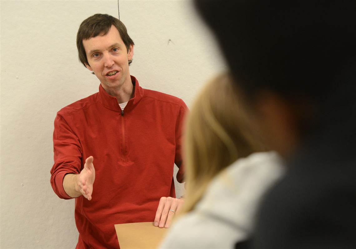 Jon Radermacher, an art professor at Robert Morris University, talks to his class about their latest project.