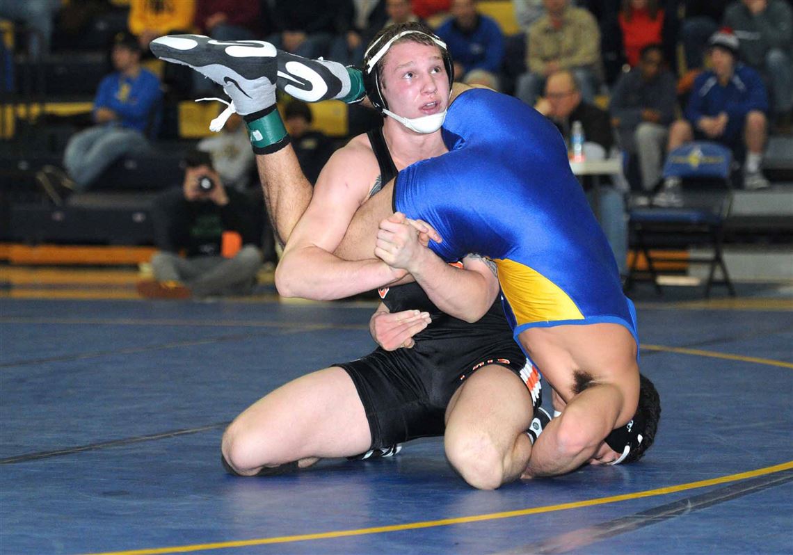Latrobe's Zack Zavatsky wrestles Mt. Lebanon's Kellan Stout in the WPIAL Class AAA/Southwest Regional Saturday at Canon-McMillan. Zavatsky won, 5-1, and raised his record to 38-0 this season.