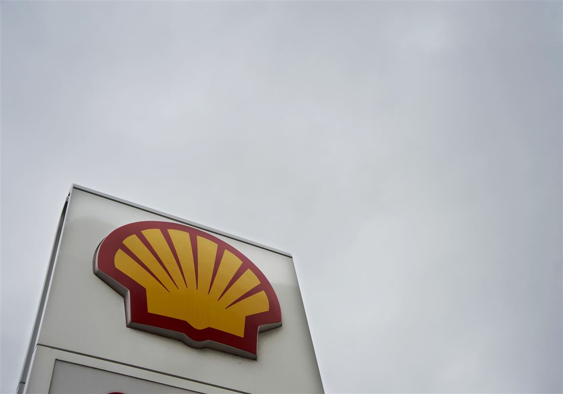 The Royal Dutch Shell logo is displayed on signage at a gas station.