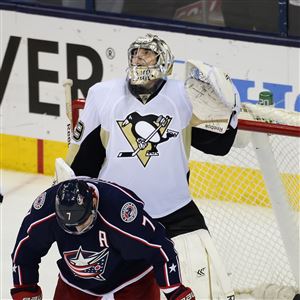 Marc-Andre Fleury watches the scoreboard as time expires in Game 6. The Penguins defeated the Blue Jackets, 4-3, to win the series, 4-2.