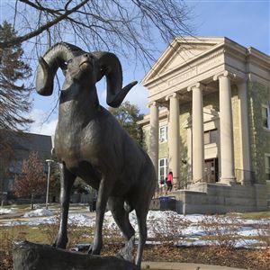 West Chester University is so popular it is considering breaking away from the state education system.  The statue of the ram mascot is seen with the old library in the background.