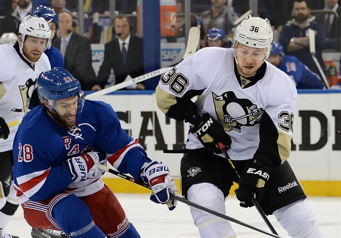 Could the Rangers' Dominic Moore (a former Penguin), shown here battling for the puck against Jussi Jokinen during a playoff game in May at Madison Square Garden in New York City, return to Pittsburgh via free-agency?
