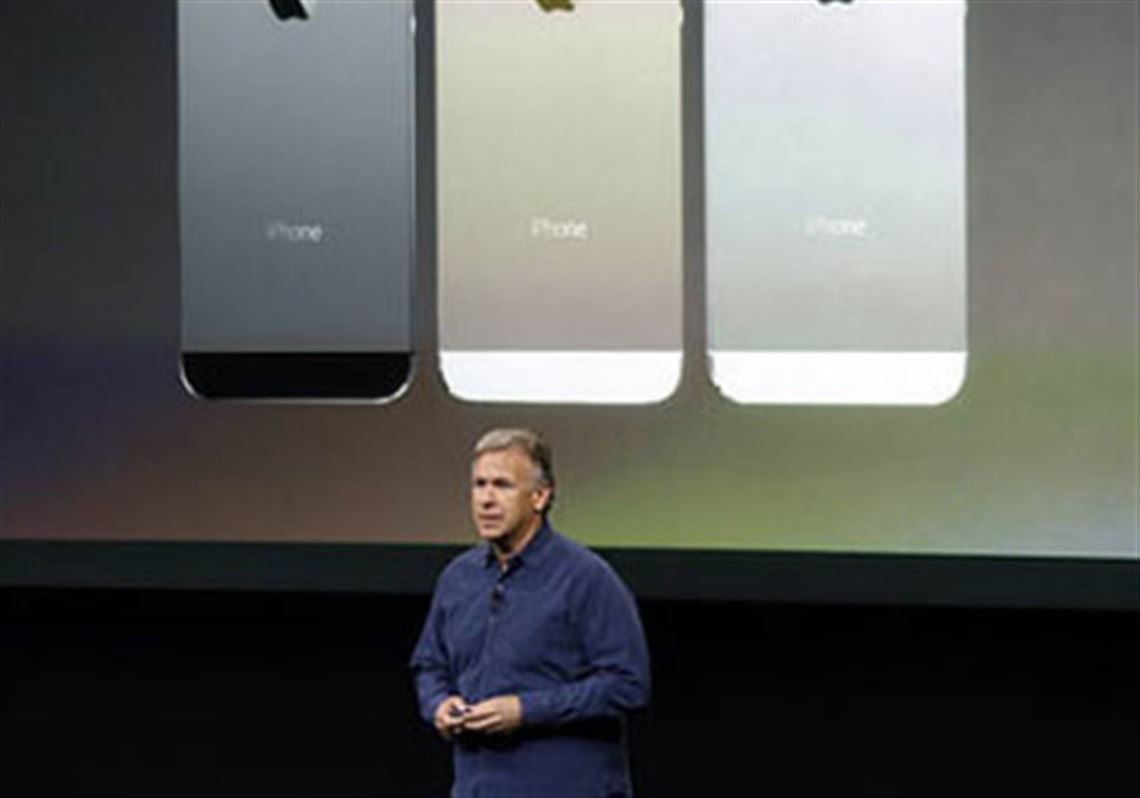 Phil Schiller, Apple's senior vice president of worldwide product marketing, speaks on stage in 2013 during the introduction of the new iPhone 5s, which included a fingerprint scanner known as Touch ID.