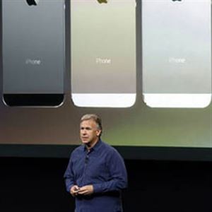 Phil Schiller, Apple's senior vice president of worldwide product marketing, speaks on stage in 2013 during the introduction of the new iPhone 5s, which included a fingerprint scanner known as Touch ID.