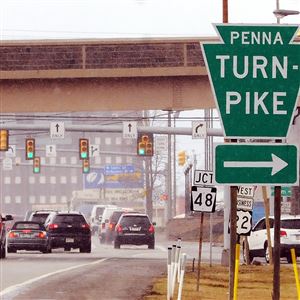 Signs lead to the Monroeville tollbooths of the Pennsylvania Turnpike.