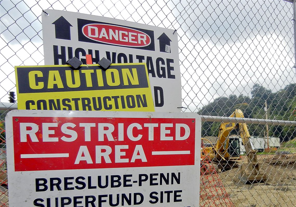 Multiple signs warn of danger at the Breslube-Penn Superfund site in Moon, which adjoins the Montour Trail. The cleanup work has meant the first half-mile of the Montour Trail likely will remain closed at least until November.