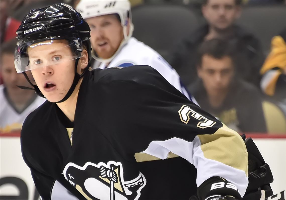 Peter Diana / Post-Gazette 12/4/2014   :  Pittsburgh Penguins Olli Maatta clears the front of the net against the Canucks at the Consol Energy Center Pittsburgh, Pa. 