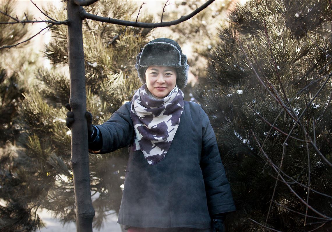 Artist Jennifer Wen Ma poses with her installation piece Tuesday in Market Square, Downtown.