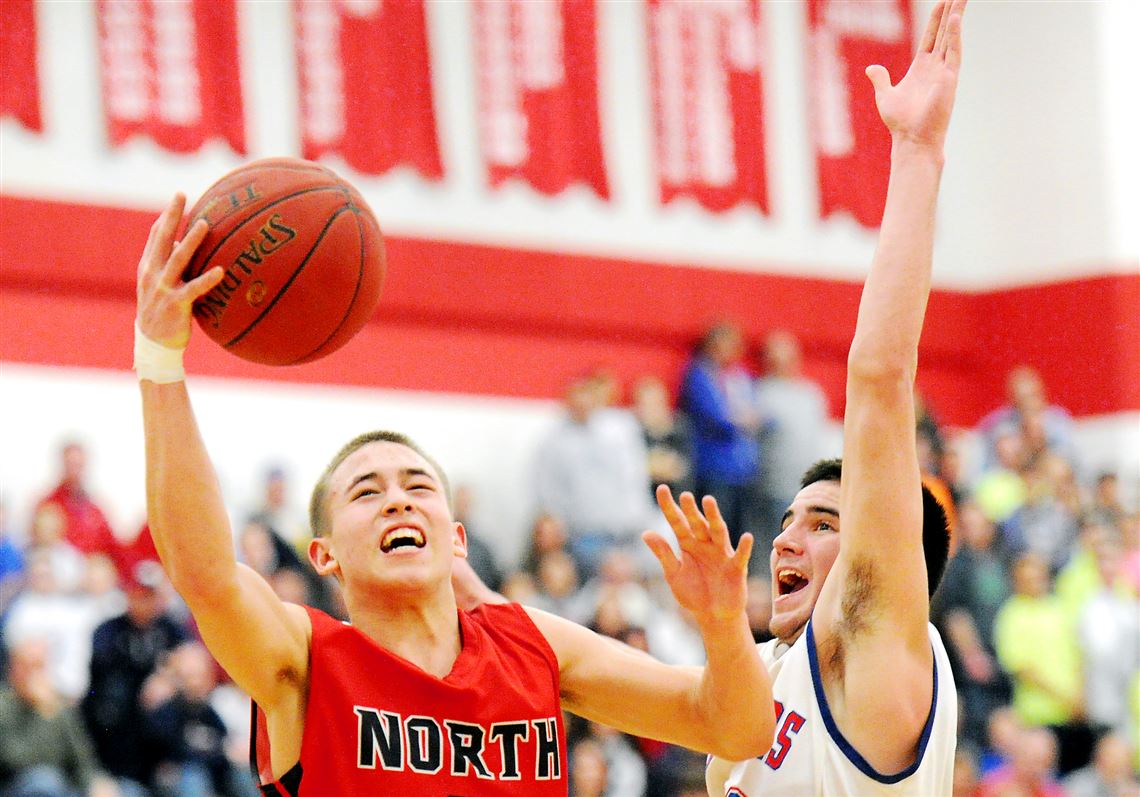 North Hills' Nick Smith goes up for a shot against Chartiers Valley's Matty McConnell Wednesday night in WPIAL playoff action Wednesday night at Moon.