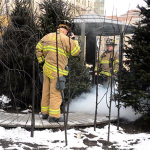 Firefighters respond to a reported incident at Market Square in Downtown today. The smoke was coming from a fog machine that was part of the art exhibition.