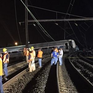 Investigators rummage through the debris left behind after an Amtrak train derailed in Philadelphia, killing at least six people.