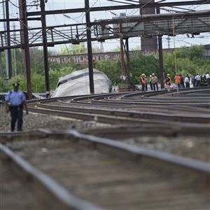 Emergency workers at the scene of a derailed Amtrak passenger train in Philadelphia on Wednesday.