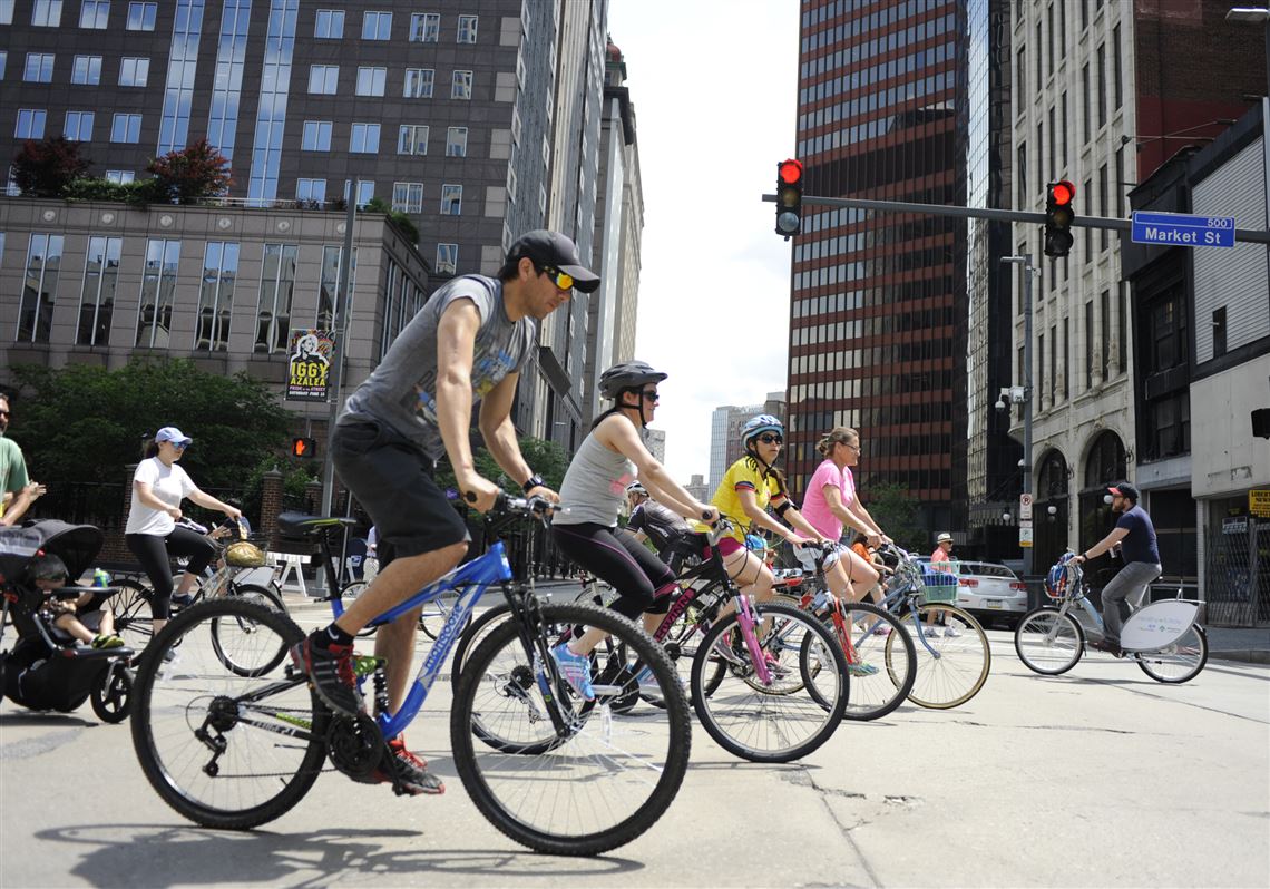 Bicyclists cross Liberty Avenue, Downtown as part of the Open Streets Pittsburgh event Sunday. 