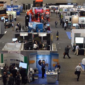 People attending the 25th Annual Meeting & Expo of Intelligent Transportation Systems browse the vendors on the exhibition floor Monday at the David L. Lawrence Convention Center, Downtown.