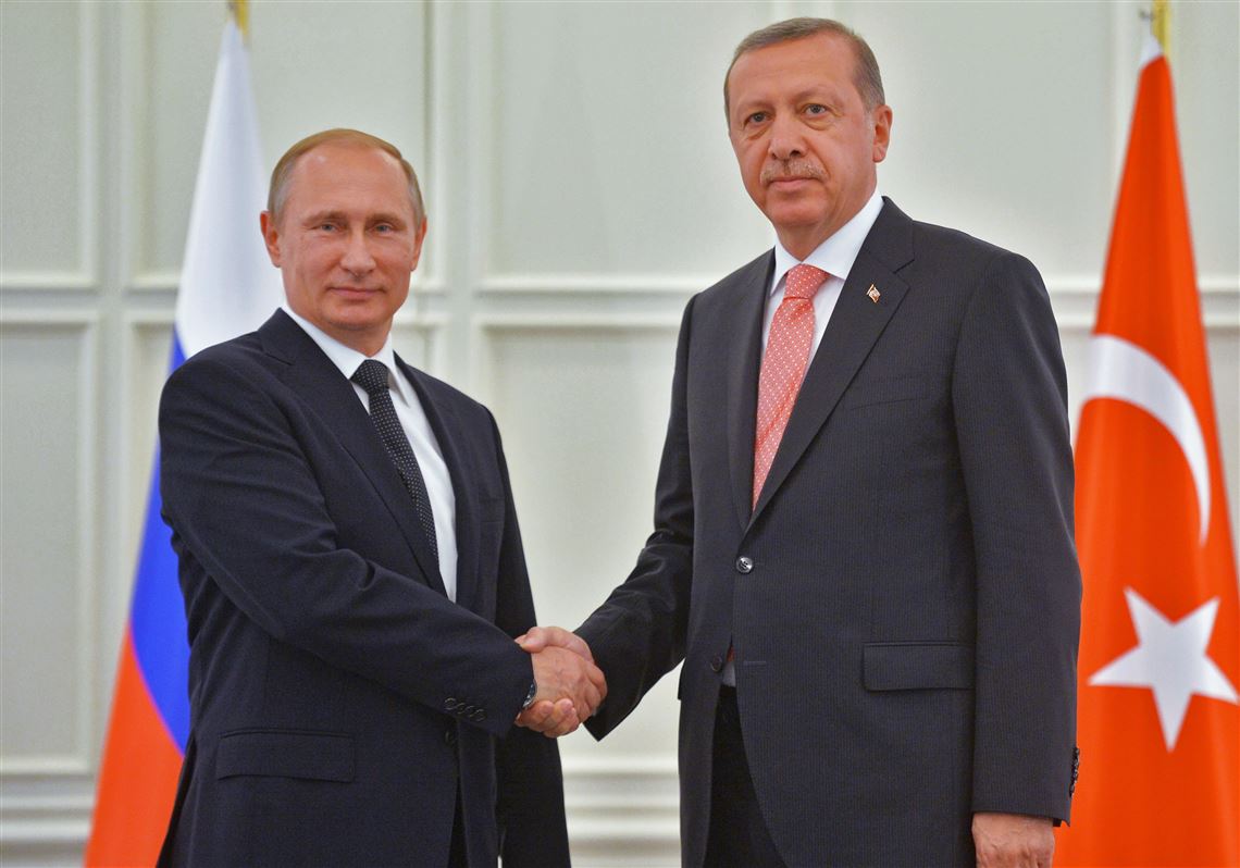 Russian President Vladimir Putin, left, and Turkish President Recep Tayyip Erdogan shake hands during their meeting in Baku, Azerbaijan, Saturday, June 13, 2015. Russian President Vladimir Putin attended the opening ceremony of the the 2015 European Games in Baku on Friday.  (Alexei Druzhinin/RIA-Novosti, Kremlin Pool Photo via AP)