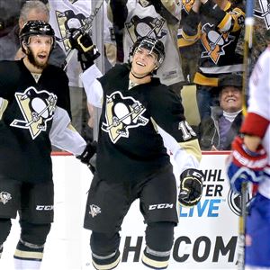 Injury-prone Penguins winger Beau Bennett injured his arm by raising it in celebration of this goal against the Canadiens earlier this month alongside teammate Nick Bonino.