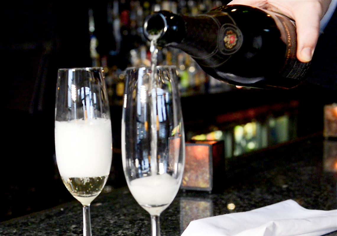 Bubbles begin to rise as champagne is poured at Eleven Contemporary Kitchen in the Strip District.