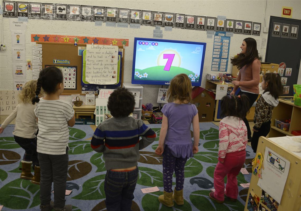 Using a smartboard, teacher Alexis Pavolik leads her preschoolers in counting numbers at Allegheny Intermediate Unit Head Start in Carnegie.