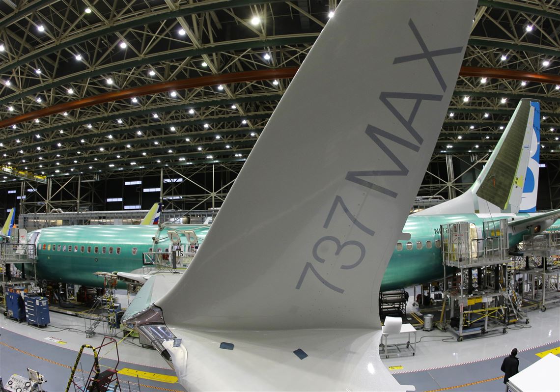 In this Monday, Dec. 7, 2015, photo, taken with a fisheye lens, the distinctive winglet on the second Boeing 737 MAX airplane being built is shown on the assembly line in Renton, Wash. On Thursday, March 3, 2016, the Commerce Department reports on U.S. factory orders for January. (AP Photo/Ted S. Warren)
