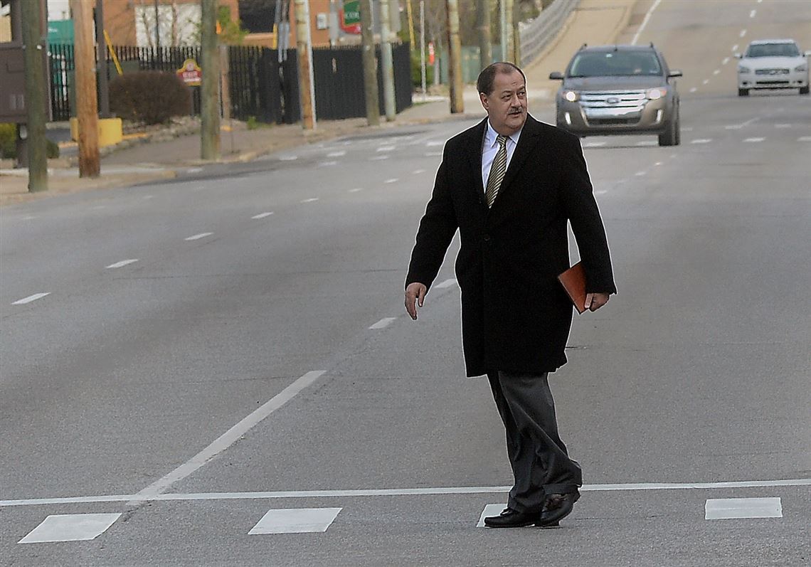 Former Massey Energy CEO Don Blankenship makes his way across Virginia Street in Charleston, W.V., before entering the Robert C. Byrd Federal Courthouse for his sentencing on Wednesday, April 6, 2016. Blankenship faces up to one year in prison and maximum fine of $250,000 for a conviction connected to the deadliest U.S. mine explosion in four decades. Prosecutors also contend he should be held liable for $28 million in restitution to a coal company related to the case.  (F. Brian Ferguson/The Gazette-Mail via AP)
