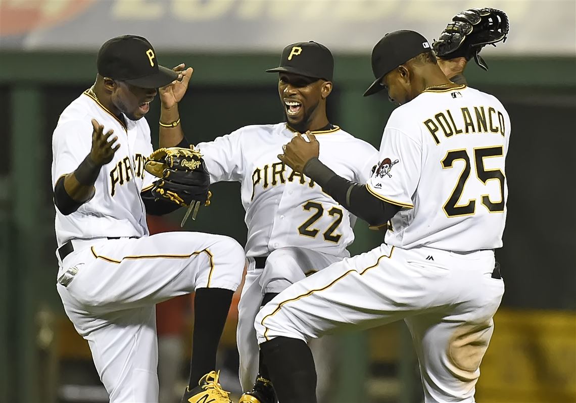 Peter Diana / Post-Gazette 04062016  PITTSBURGH Sports:  Pittsburgh Pirates Starling Marte, Andrew McCutchen and Gregory Polanco celebrate after sweeping the Cardinals at PNC Park PIttsburgh PA