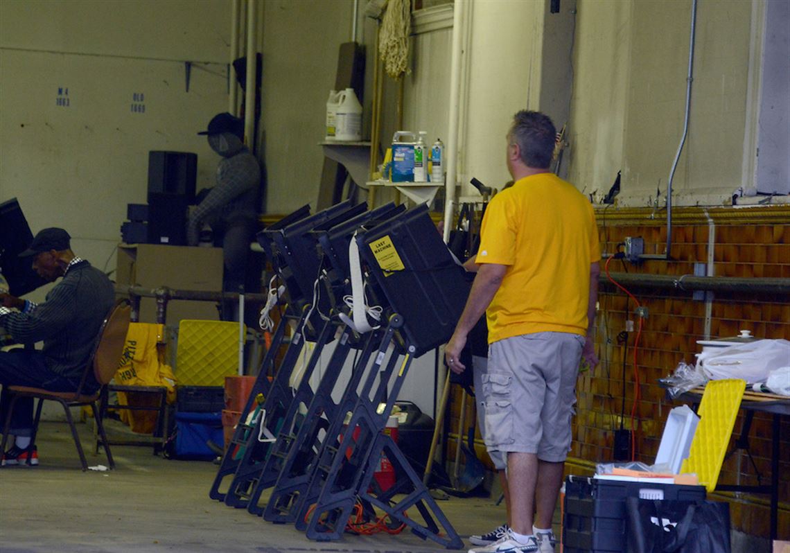 Polling station employees get ready before 7 a.m. at the City of Pittsburgh’s Medic #4 station on the North Side.