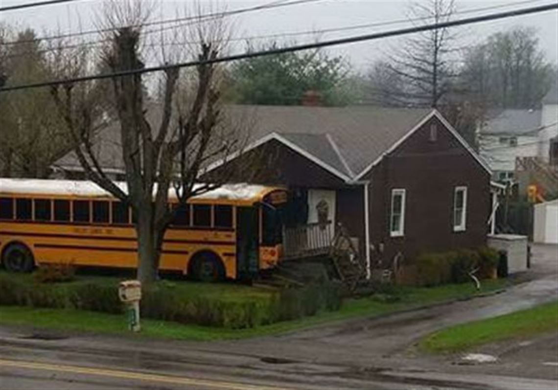 Police are investigating why a school bus crashed into a house in Butler Township this morning.