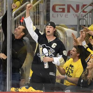 Pirates pitcher Gerrit Cole cheers on the Penguins Wednesday night at Consol Energy Center.
