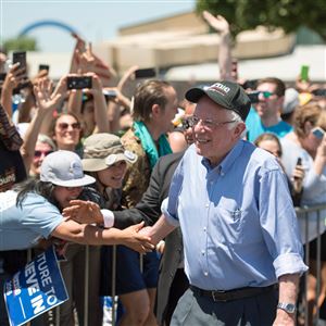 Democratic presidential candidate and Vermont Sen. Bernie Sanders shakes hands with attendees Wednesday in San Jose, Calif., before the start of a rally.